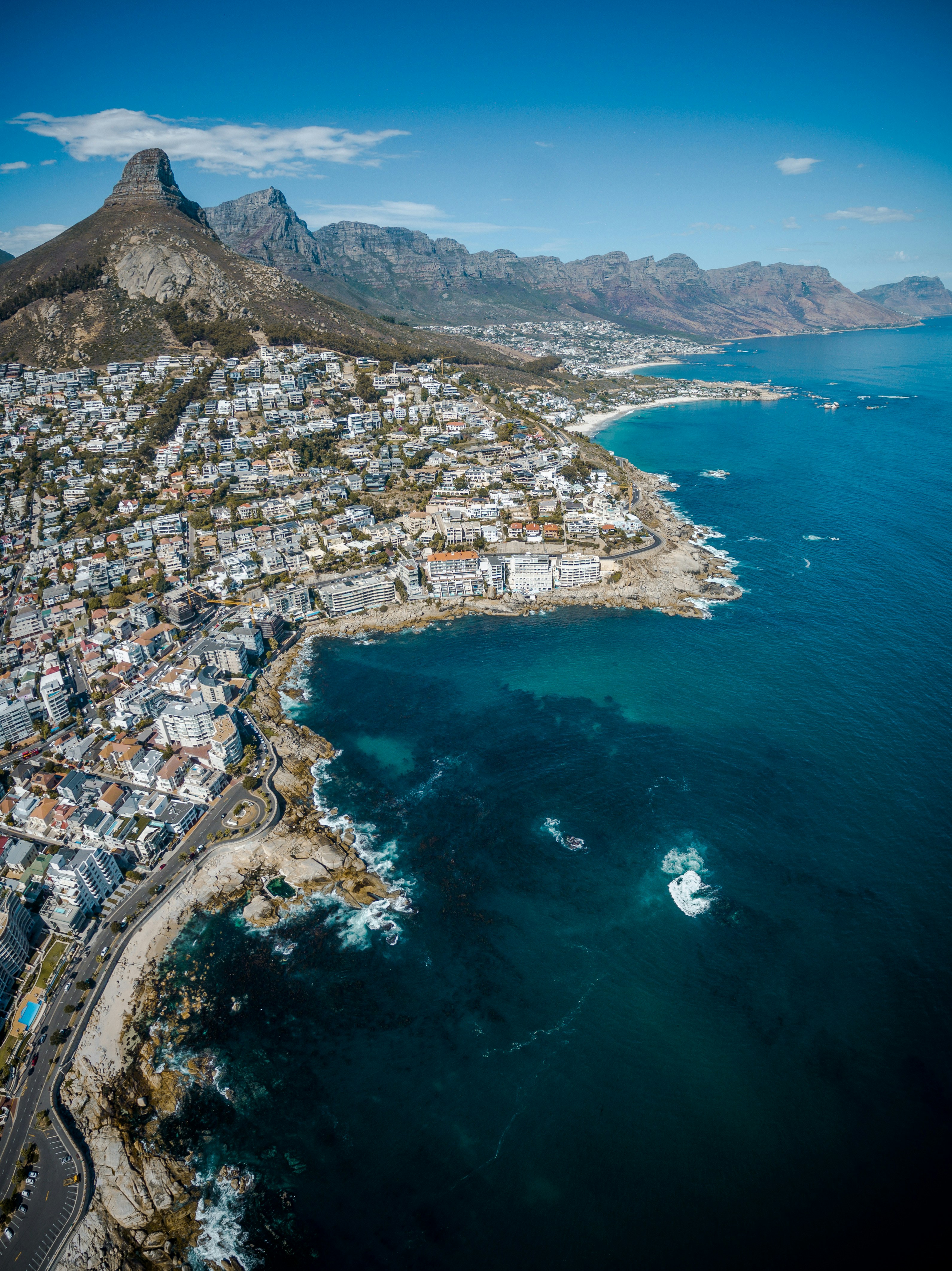 Coastal city view with mountain backdrop